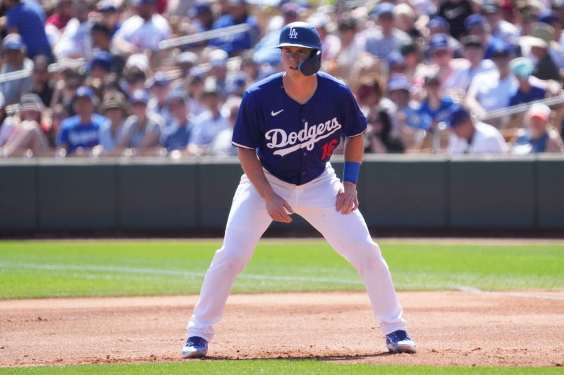 Mar 10, 2024; Phoenix, Arizona, USA; Los Angeles Dodgers catcher Will Smith (16) leads off first base against the Arizona Diamondbacks during the first inning at Camelback Ranch-Glendale. Mandatory Credit: Joe Camporeale-USA TODAY Sports