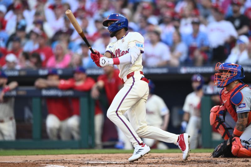 Oct 6, 2024; Philadelphia, Pennsylvania, USA; Philadelphia Phillies outfielder Johan Rojas (18) hits a single in the third inning against the New York Mets during game two of the NLDS for the 2024 MLB Playoffs at Citizens Bank Park. Mandatory Credit: Kyle Ross-Imagn Images