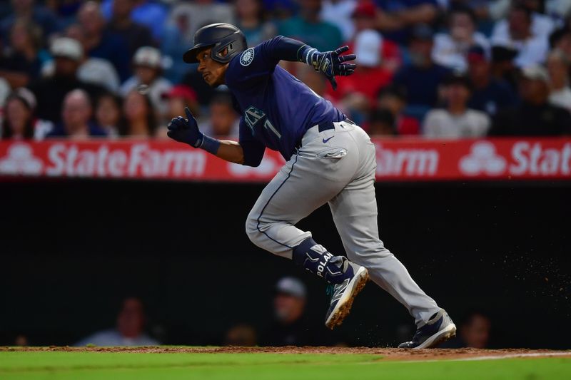 Jul 11, 2024; Anaheim, California, USA; Seattle Mariners second baseman Jorge Polanco (7) hits a single against the Los Angeles Angels during the sixth inning at Angel Stadium. Mandatory Credit: Gary A. Vasquez-USA TODAY Sports