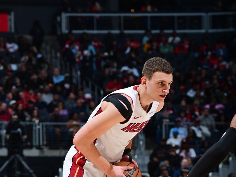 ATLANTA, GA - APRIL 9: Nikola Jovic #5 of the Miami Heat handles the ball during the game against the Atlanta Hawks on April 9, 2024 at State Farm Arena in Atlanta, Georgia.  NOTE TO USER: User expressly acknowledges and agrees that, by downloading and/or using this Photograph, user is consenting to the terms and conditions of the Getty Images License Agreement. Mandatory Copyright Notice: Copyright 2024 NBAE (Photo by Scott Cunningham/NBAE via Getty Images)