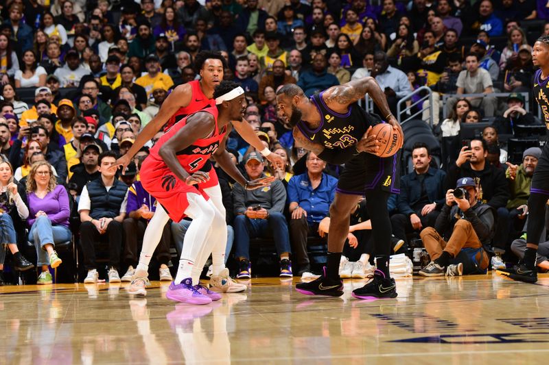 LOS ANGELES, CA - JANUARY 9: LeBron James #6 of the Los Angeles Lakers looks to pass the ball during the game against the Toronto Raptors on January 9, 2024 at Crypto.Com Arena in Los Angeles, California. NOTE TO USER: User expressly acknowledges and agrees that, by downloading and/or using this Photograph, user is consenting to the terms and conditions of the Getty Images License Agreement. Mandatory Copyright Notice: Copyright 2024 NBAE (Photo by Adam Pantozzi/NBAE via Getty Images)