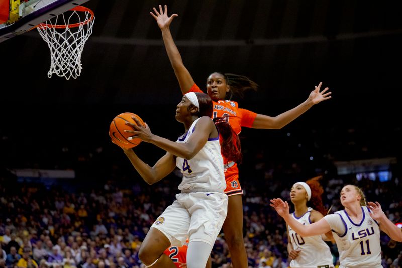 Feb 22, 2024; Baton Rouge, Louisiana, USA;  LSU Lady Tigers guard Flau'jae Johnson (4) shoots against Auburn Tigers forward Taylen Collins (14) during the first half at Pete Maravich Assembly Center. Mandatory Credit: Matthew Hinton-USA TODAY Sports