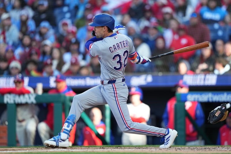 Mar 28, 2026; Philadelphia, Pennsylvania, USA; Texas Rangers outfielder Evan Carter (32) hits a single against the Philadelphia Phillies in the fourth inning at Citizens Bank Park. Mandatory Credit: Kyle Ross-Imagn Images