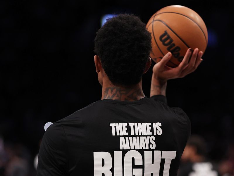 NEW YORK, NEW YORK - JANUARY 15:  Nic Claxton #33 of the Brooklyn Nets  wears a shirt honoring Martin Luther King before the game against the Miami Heat at Barclays Center on January 15, 2024 in New York City.   User expressly acknowledges and agrees that, by downloading and or using this photograph, User is consenting to the terms and conditions of the Getty Images License Agreement.  (Photo by Al Bello/Getty Images)