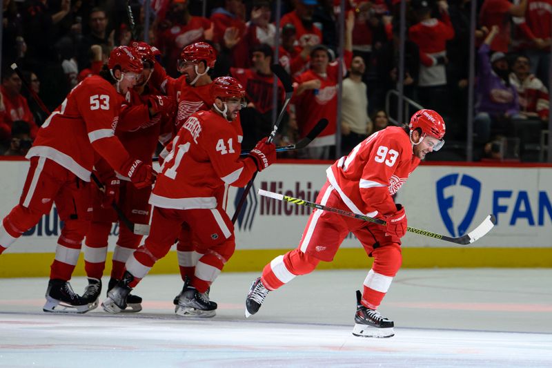 Oct 24, 2023; Detroit, Michigan, USA; Detroit Red Wings right wing Alex DeBrincat (93) celebrates with his teamates after scoring a power play goal against the Seattle Kraken in the third period at Little Caesars Arena. Mandatory Credit: Lon Horwedel-USA TODAY Sports