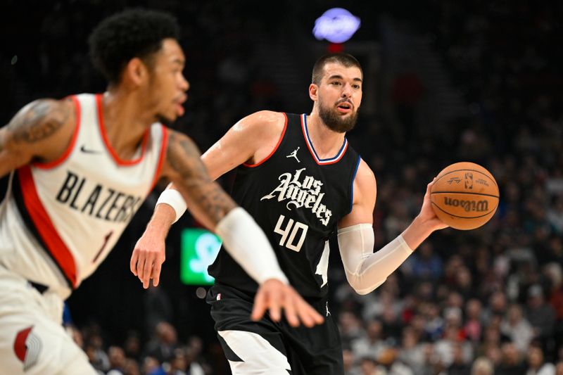 PORTLAND, OREGON - MARCH 22: Ivica Zubac #40 of the LA Clippers looks to pass the ball during the first quarter of the game against the Portland Trail Blazers at the Moda Center on March 22, 2024 in Portland, Oregon. NOTE TO USER: User expressly acknowledges and agrees that, by downloading and or using this photograph, User is consenting to the terms and conditions of the Getty Images License Agreement. (Photo by Alika Jenner/Getty Images)