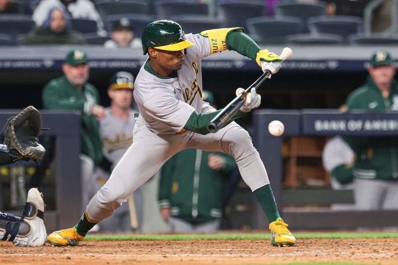 Apr 25, 2024; Bronx, New York, USA; Oakland Athletics left fielder Esteury Ruiz (1) lays down a sacrifice bunt during the eighth inning against the New York Yankees at Yankee Stadium. Mandatory Credit: Vincent Carchietta-USA TODAY Sports