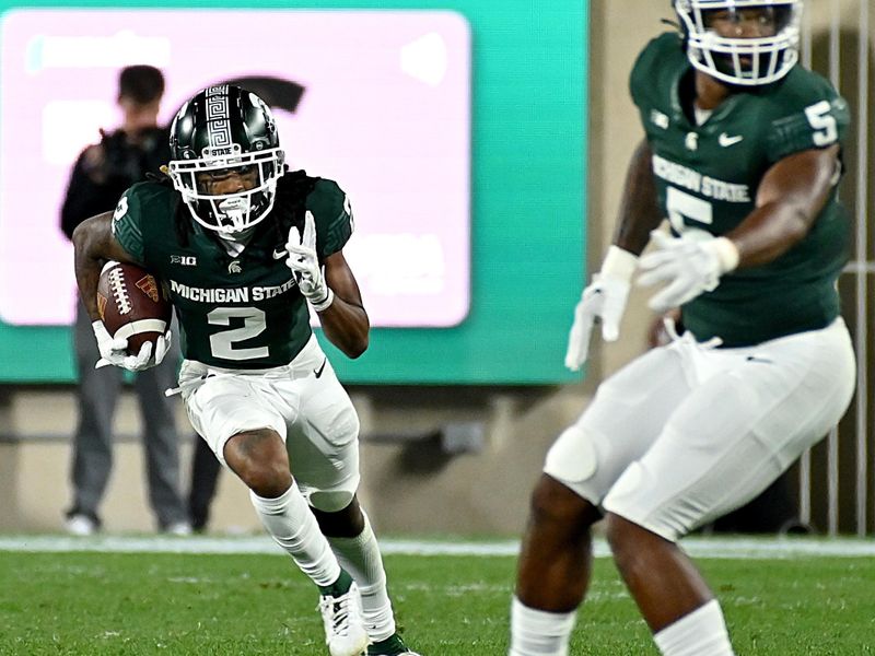 Sep 1, 2023; East Lansing, Michigan, USA; Michigan State Spartans wide receiver Tyrell Henry (2) runs a Central Michigan Chippewas punt upfield in the fourth quarter at Spartan Stadium. Mandatory Credit: Dale Young-USA TODAY Sports