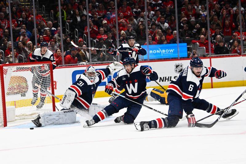 Dec 30, 2023; Washington, District of Columbia, USA; Washington Capitals goalie Hunter Shepard (31) makes a safe against the Nashville Predators during the second period at Capital One Arena. Mandatory Credit: Brad Mills-USA TODAY Sports