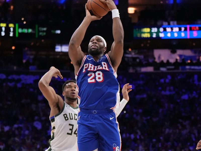 PHILADELPHIA, PA - OCTOBER 23: Guerschon Yabusele #28 of the Philadelphia 76ers shoots the ball during the game against the Milwaukee Bucks on October 23, 2024 at the Wells Fargo Center in Philadelphia, Pennsylvania NOTE TO USER: User expressly acknowledges and agrees that, by downloading and/or using this Photograph, user is consenting to the terms and conditions of the Getty Images License Agreement. Mandatory Copyright Notice: Copyright 2024 NBAE (Photo by Jesse D. Garrabrant/NBAE via Getty Images)