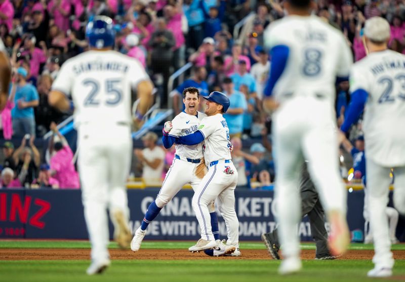 May 17, 2025; Toronto, Ontario, CAN; Toronto Blue Jays third base Ernie Clement (22) celebrates after hitting a walk off single to defeat the Detroit Tigers during the ninth inning in their MLB game at Rogers Centre. Mandatory Credit: Kevin Sousa-Imagn Images
