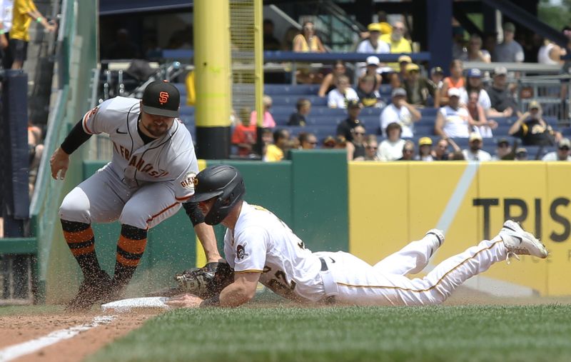 Jul 16, 2023; Pittsburgh, Pennsylvania, USA;  Pittsburgh Pirates right fielder Henry Davis (right) steals third base ahead of the tag attempt of San Francisco Giants third baseman J.D. Davis (7) during the sixth inning at PNC Park. Mandatory Credit: Charles LeClaire-USA TODAY Sports