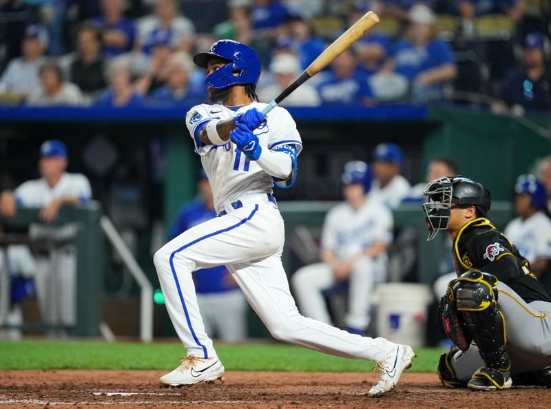 Aug 30, 2023; Kansas City, Missouri, USA; Kansas City Royals third baseman Maikel Garcia (11) hits a triple against the Pittsburgh Pirates during the ninth inning at Kauffman Stadium. Mandatory Credit: Jay Biggerstaff-USA TODAY Sports