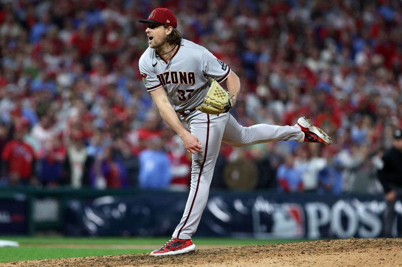 Oct 24, 2023; Philadelphia, Pennsylvania, USA; Arizona Diamondbacks relief pitcher Kevin Ginkel (37) throws a pitch against the Philadelphia Phillies in the seventh inning for game seven of the NLCS for the 2023 MLB playoffs at Citizens Bank Park. Mandatory Credit: Bill Streicher-USA TODAY Sports