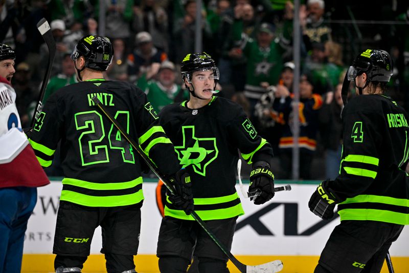 Nov 29, 2024; Dallas, Texas, USA; Dallas Stars center Wyatt Johnston (53) and center Roope Hintz (24) and defenseman Miro Heiskanen (4) celebrates a goal scored by Hintz against the Colorado Avalanche during the second period at the American Airlines Center. Mandatory Credit: Jerome Miron-Imagn Images