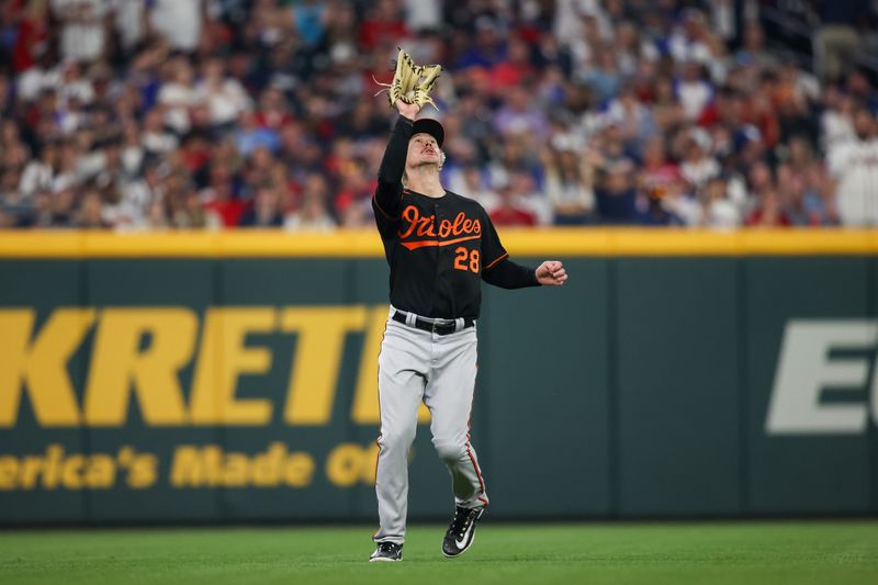 May 6, 2023; Atlanta, Georgia, USA; Baltimore Orioles left fielder Kyle Stowers (28) catches a fly ball against the Atlanta Braves in the sixth inning at Truist Park. Mandatory Credit: Brett Davis-USA TODAY Sports