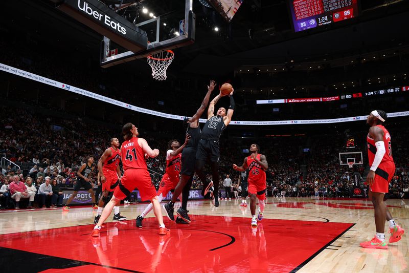 TORONTO, CANADA - JANUARY 01: Jalen Wilson #22 of the Brooklyn Nets rebounds the ball during the game against the Toronto Raptors on January 1, 2025 at the Scotiabank Arena in Toronto, Ontario, Canada.  NOTE TO USER: User expressly acknowledges and agrees that, by downloading and or using this Photograph, user is consenting to the terms and conditions of the Getty Images License Agreement.  Mandatory Copyright Notice: Copyright 2025 NBAE (Photo by Vaughn Ridley/NBAE via Getty Images)