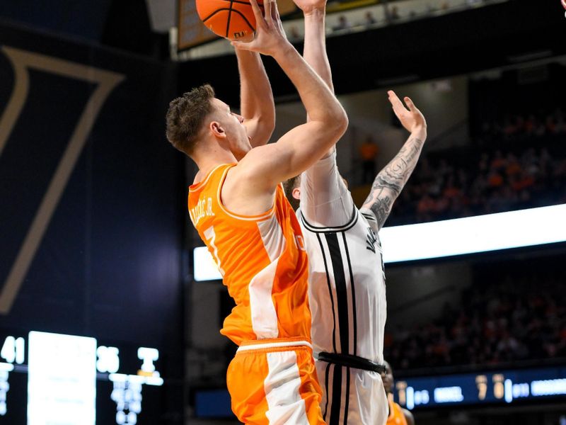 Jan 18, 2025; Nashville, Tennessee, USA;  Tennessee Volunteers forward Igor Milicic Jr. (7) shoots over Vanderbilt Commodores guard Tyler Nickel (5) during the second half at Memorial Gymnasium. Mandatory Credit: Steve Roberts-Imagn Images