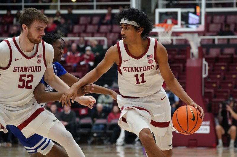 Dec 17, 2025; Stanford, California, USA;  Stanford Cardinal guard Ryan Agarwal (11) runs around a screen from  forward/center Aidan Cammann (52) against Texas-Arlington Mavericks guard Bahsil Laster (8) in the first half at Maples Pavilion. Mandatory Credit: David Gonzales-Imagn Images