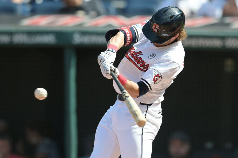 Sep 15, 2024; Cleveland, Ohio, USA; Cleveland Guardians third baseman Daniel Schneemann (10) hits a double during the second inning against the Tampa Bay Rays at Progressive Field. Mandatory Credit: Ken Blaze-Imagn Images