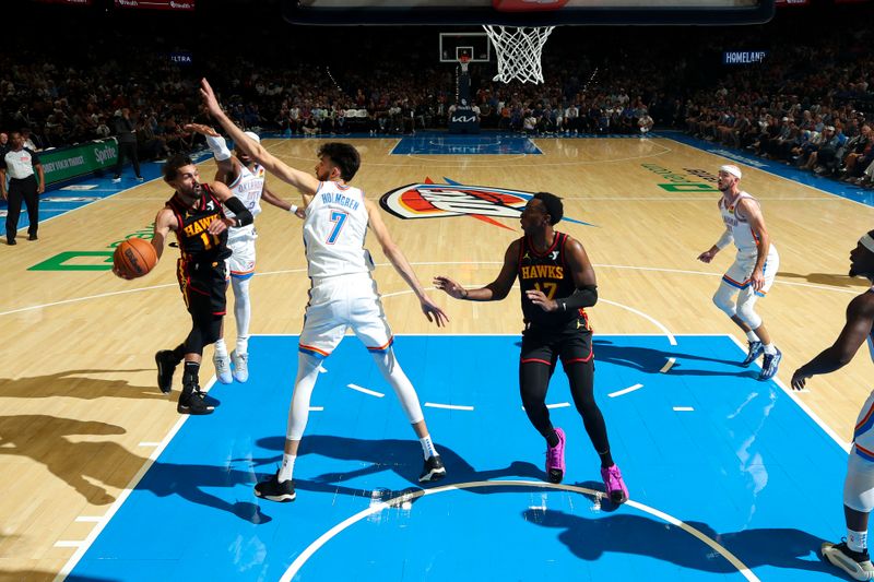 OKLAHOMA CITY, OK - OCTOBER 27: Trae Young #11 of the Atlanta Hawks passes the ball to teammate Onyeka Okongwu #17 during the game on October 27, 2024 at Paycom Center in Oklahoma City, Oklahoma. NOTE TO USER: User expressly acknowledges and agrees that, by downloading and or using this photograph, User is consenting to the terms and conditions of the Getty Images License Agreement. Mandatory Copyright Notice: Copyright 2024 NBAE (Photo by Zach Beeker/NBAE via Getty Images)