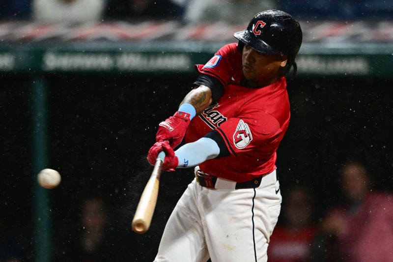 Sep 28, 2024; Cleveland, Ohio, USA; Cleveland Guardians third baseman Jose Ramirez (11) hits a double during the eighth inning against the Houston Astros at Progressive Field. Mandatory Credit: Ken Blaze-Imagn Images