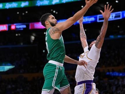 LOS ANGELES, CALIFORNIA - DECEMBER 25: Jayson Tatum #0 of the Boston Celtics drives over Anthony Davis #3 of the Los Angeles Lakers in the second half at Crypto.com Arena on December 25, 2023 in Los Angeles, California. NOTE TO USER: User expressly acknowledges and agrees that, by downloading and or using this photograph, User is consenting to the terms and conditions of the Getty Images License Agreement.(Photo by Jayne Kamin-Oncea/Getty Images)