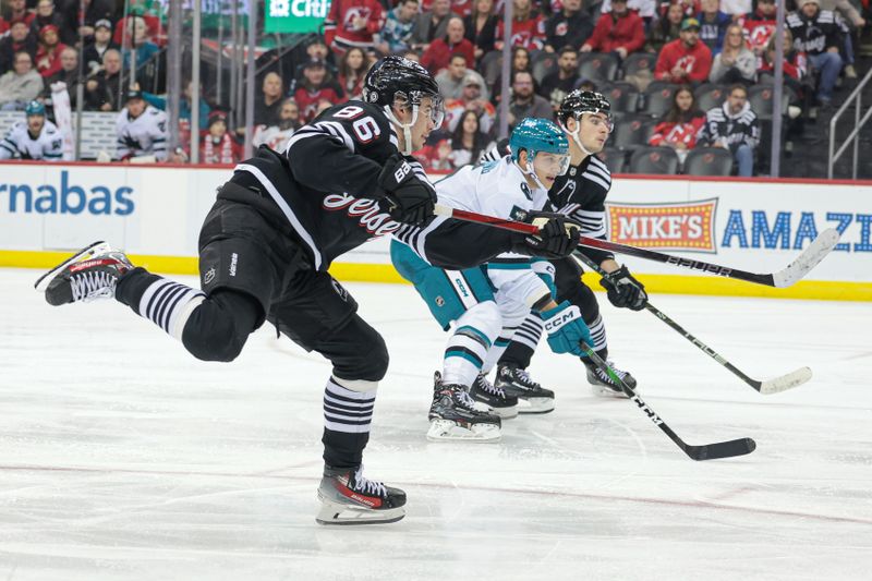 Dec 1, 2023; Newark, New Jersey, USA; New Jersey Devils center Jack Hughes (86) scores a goal during the second period against the San Jose Sharks at Prudential Center. Mandatory Credit: Vincent Carchietta-USA TODAY Sports