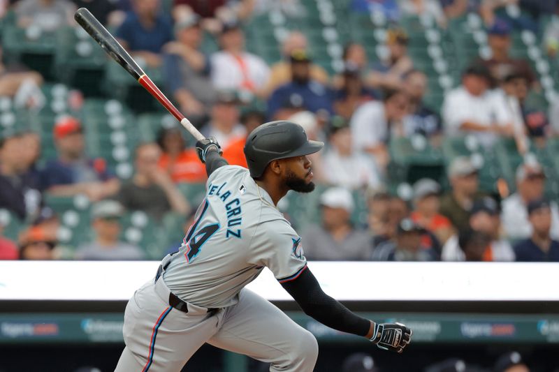 May 13, 2024; Detroit, Michigan, USA;  Miami Marlins outfielder Bryan De La Cruz (14) hits an RBI single in the fifth inning against the Detroit Tigers at Comerica Park. Mandatory Credit: Rick Osentoski-USA TODAY Sports