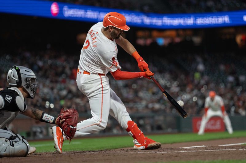 Aug 20, 2024; San Francisco, California, USA;  San Francisco Giants catcher Curt Casali (2) hits a single during the fifth inning against the Chicago White Sox at Oracle Park. Mandatory Credit: Stan Szeto-USA TODAY Sports