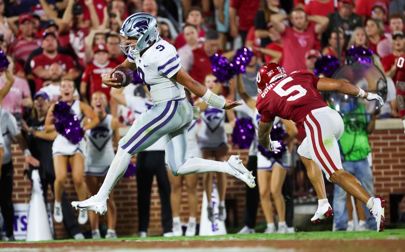 Sep 24, 2022; Norman, Oklahoma, USA;  Kansas State Wildcats quarterback Adrian Martinez (9) runs past Oklahoma Sooners defensive back Billy Bowman (5) to score a touchdown during the second half at Gaylord Family-Oklahoma Memorial Stadium. Mandatory Credit: Kevin Jairaj-USA TODAY Sports