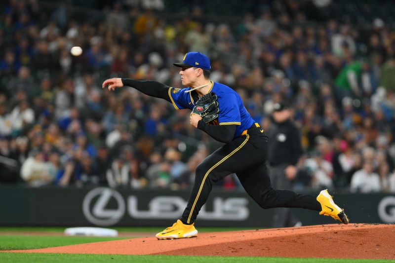 Sep 27, 2024; Seattle, Washington, USA;  Seattle Mariners starting pitcher Bryan Woo (22) pitches to the Oakland Athletics during the first inning at T-Mobile Park. Mandatory Credit: Steven Bisig-Imagn Images