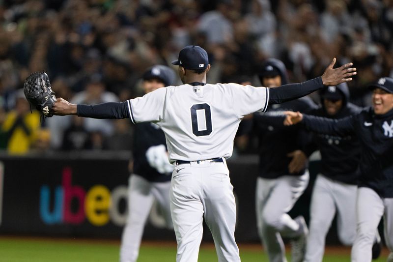 Jun 28, 2023; Oakland, California, USA;  New York Yankees starting pitcher Domingo German (0) celebrates with teammates after pitching a perfect game against the Oakland Athletics at Oakland-Alameda County Coliseum. It was the first perfect game in MLB since 2012 and the fourth perfect game in franchise history. Mandatory Credit: Stan Szeto-USA TODAY Sports