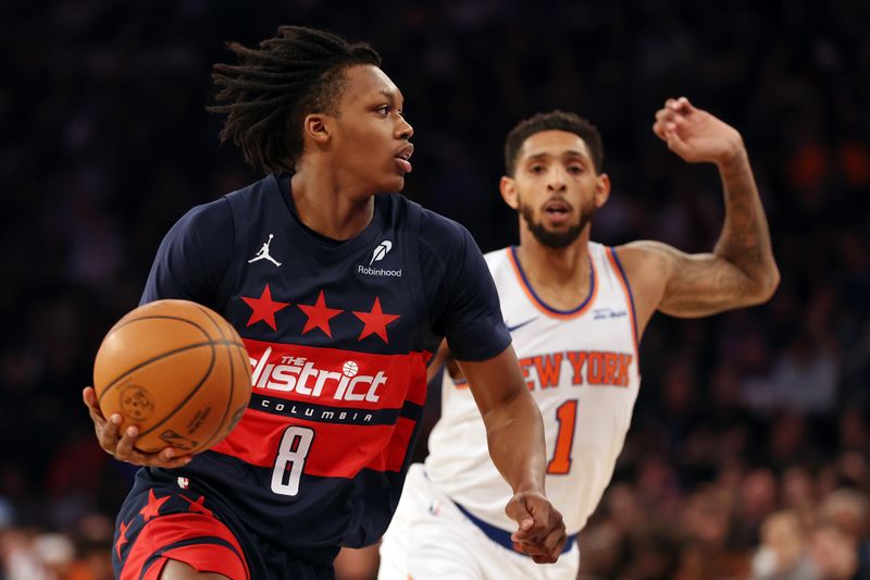 NEW YORK, NEW YORK - NOVEMBER 18: Carlton Carrington #8 of the Washington Wizards dribbles as Cameron Payne #1 of the New York Knicks defends during the first half at Madison Square Garden on November 18, 2024 in New York City. NOTE TO USER: User expressly acknowledges and agrees that, by downloading and or using this photograph, User is consenting to the terms and conditions of the Getty Images License Agreement. (Photo by Sarah Stier/Getty Images)