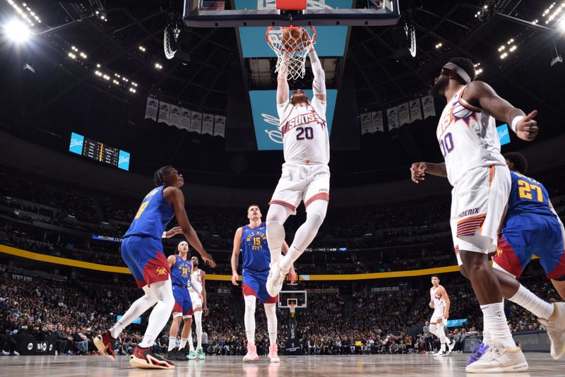 DENVER, CO - MARCH 5: Jusuf Nurkic #20 of the Phoenix Suns dunks the ball during the game against the Denver Nuggets on March 5, 2024 at the Ball Arena in Denver, Colorado. NOTE TO USER: User expressly acknowledges and agrees that, by downloading and/or using this Photograph, user is consenting to the terms and conditions of the Getty Images License Agreement. Mandatory Copyright Notice: Copyright 2024 NBAE (Photo by Garrett Ellwood/NBAE via Getty Images)