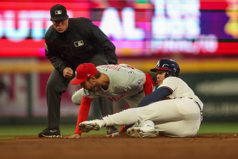 Apr 10, 2025; Atlanta, Georgia, USA; Atlanta Braves right fielder Stuart Fairchild (17) steals second base past Philadelphia Phillies shortstop Trea Turner (7) in the second inning at Truist Park. Mandatory Credit: Brett Davis-Imagn Images
