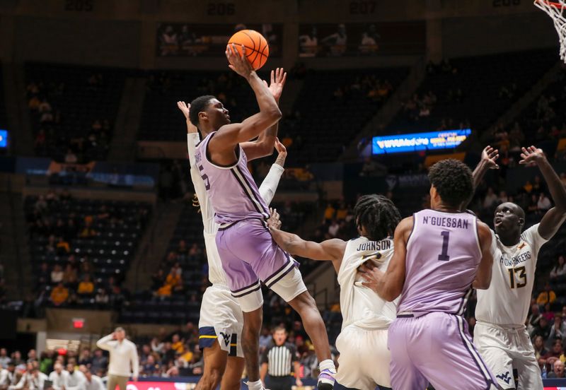 Jan 9, 2024; Morgantown, West Virginia, USA; Kansas State Wildcats guard Cam Carter (5) shoots a jumper during the second half against the West Virginia Mountaineers at WVU Coliseum. Mandatory Credit: Ben Queen-USA TODAY Sports