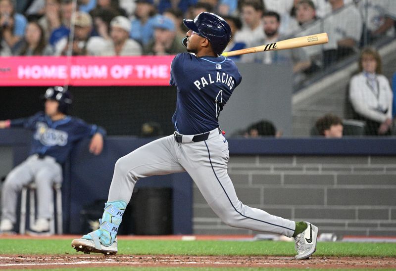 May 17, 2024; Toronto, Ontario, CAN;  Tampa Bay Rays second baseman Richie Palacios (10) hits a two run home run against the Toronto Blue Jays in the sixth inning at Rogers Centre. Mandatory Credit: Dan Hamilton-USA TODAY Sports