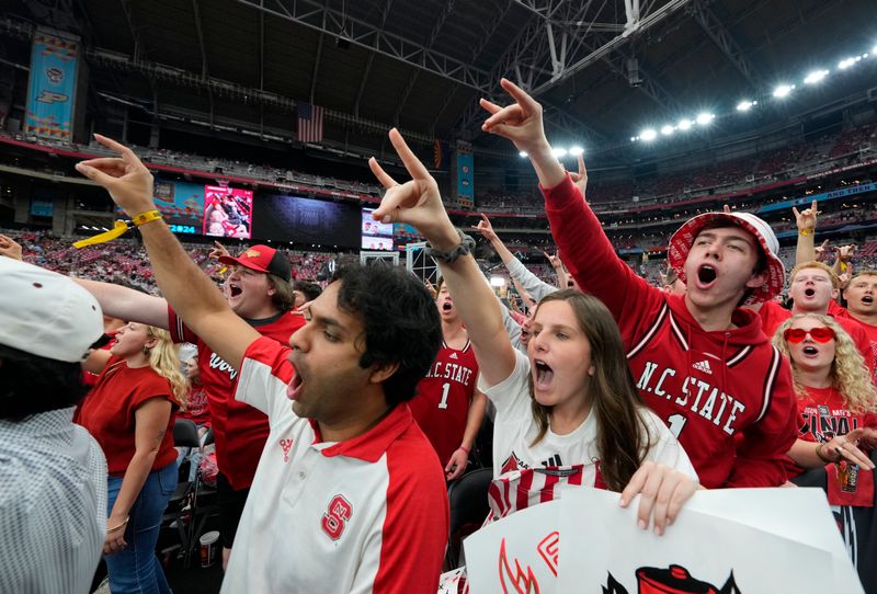 Apr 6, 2024; Glendale, AZ, USA; North Carolina State Wolfpack fans cheer before the semifinals of the men's Final Four of the 2024 NCAA Tournament against the Purdue Boilermakers at State Farm Stadium. Mandatory Credit: Robert Deutsch-USA TODAY Sports