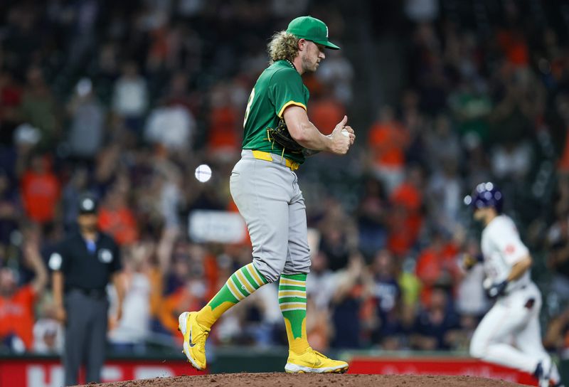 May 16, 2024; Houston, Texas, USA; Oakland Athletics starting pitcher Joey Estes (68) reacts and Houston Astros left fielder Joey Loperfido (10) rounds the bases after hitting a home run during the third inning at Minute Maid Park. Mandatory Credit: Troy Taormina-USA TODAY Sports