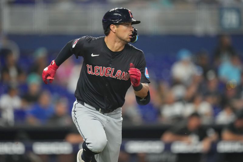 Jun 9, 2024; Miami, Florida, USA; Cleveland Guardians center fielder Tyler Freeman (2) hits a single against the Miami Marlins in the ninth inning at loanDepot Park. Mandatory Credit: Jim Rassol-USA TODAY Sports