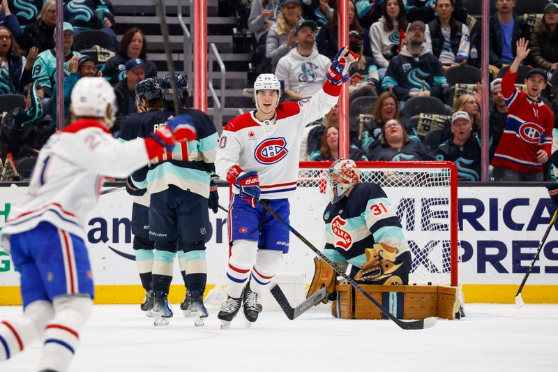 Mar 24, 2024; Seattle, Washington, USA; Montreal Canadiens left wing Juraj Slafkovsky (20) celebrates after scoring a goal against Seattle Kraken goaltender Philipp Grubauer (31) during the first period at Climate Pledge Arena. Mandatory Credit: Joe Nicholson-USA TODAY Sports