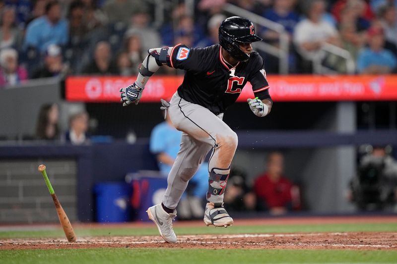 May 4, 2025; Toronto, Ontario, CAN; Cleveland Guardians center fielder Angel Martinez (1) hits a single against the Toronto Blue Jays during the ninth inning at Rogers Centre. Mandatory Credit: John E. Sokolowski-Imagn Images