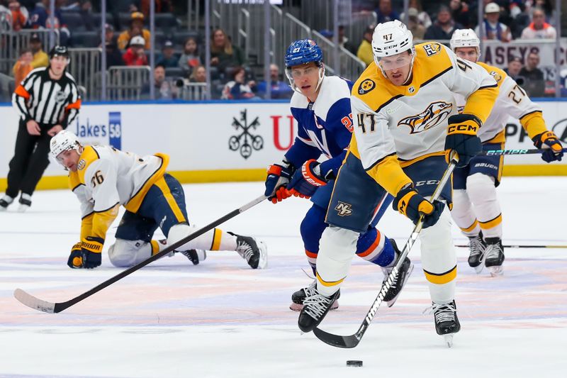 Apr 6, 2024; Elmont, New York, USA; Nashville Predators right wing Michael McCarron (47) skates the puck into the zone against the New York Islanders during the first period at UBS Arena. Mandatory Credit: Tom Horak-USA TODAY Sports