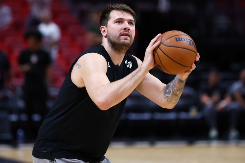 MIAMI, FLORIDA - APRIL 10: Luka Doncic #77 of the Dallas Mavericks warms up prior to a game against the Miami Heat at Kaseya Center on April 10, 2024 in Miami, Florida. NOTE TO USER: User expressly acknowledges and agrees that, by downloading and or using this photograph, User is consenting to the terms and conditions of the Getty Images License Agreement. (Photo by Megan Briggs/Getty Images)