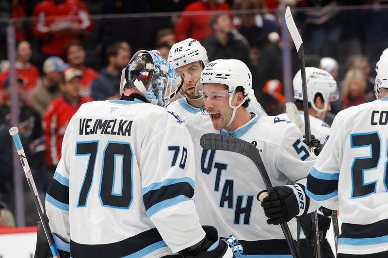 Mar 3, 2026; Washington, District of Columbia, USA; Utah Mammoth goalie Karel Vejmelka (70) celebrates with Mammoth defenseman Sean Durzi (50) after defeating the Washington Capitals at Capital One Arena. Mandatory Credit: Amber Searls-Imagn Images