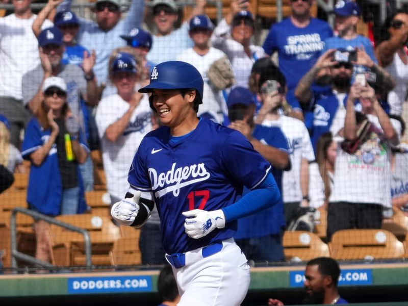 Feb 27, 2024; Phoenix, Arizona, USA; Los Angeles Dodgers designated hitter Shohei Ohtani (17) runs the bases after hitting a two run home run during the fifth inning against the Chicago White Sox at Camelback Ranch-Glendale. Mandatory Credit: Joe Camporeale-USA TODAY Sports