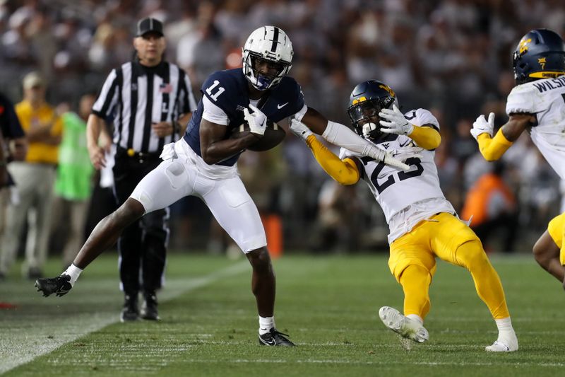 Sep 2, 2023; University Park, Pennsylvania, USA; Penn State Nittany Lions wide receiver Malik McClain (11) avoids a tackle while running with the ball during the third quarter against the West Virginia Mountaineers at Beaver Stadium. Penn State defeated West Virginia 38-15. Mandatory Credit: Matthew O'Haren-USA TODAY Sports