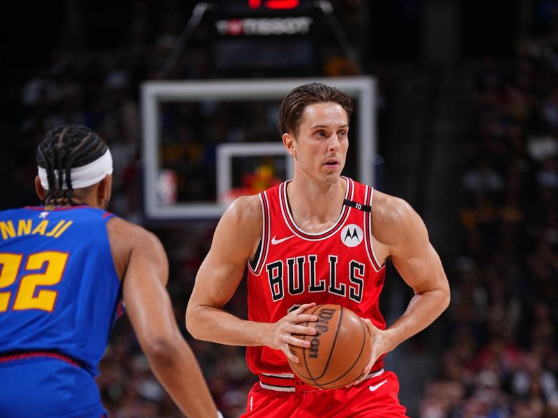 DENVER, CO - MARCH 24: Zach Collins #12 of the Chicago Bulls looks to pass the ball during the game against the Denver Nuggets on March 24, 2025 at Ball Arena in Denver, Colorado. NOTE TO USER: User expressly acknowledges and agrees that, by downloading and/or using this Photograph, user is consenting to the terms and conditions of the Getty Images License Agreement. Mandatory Copyright Notice: Copyright 2025 NBAE (Photo by Garrett Ellwood/NBAE via Getty Images)