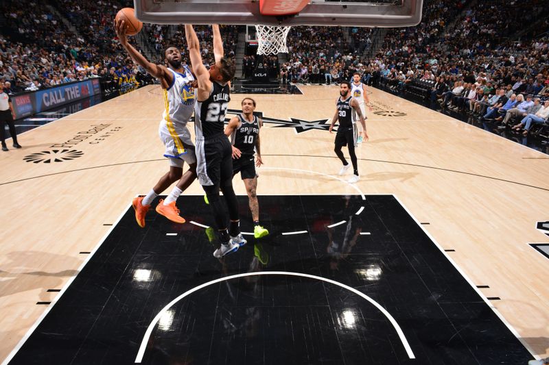 SAN ANTONIO, TX - MARCH 11: Andrew Wiggins #22 of the Golden State Warriors drives to the basket during the game against the San Antonio Spurs on March 11, 2024 at the AT&T Center in San Antonio, Texas. NOTE TO USER: User expressly acknowledges and agrees that, by downloading and or using this photograph, user is consenting to the terms and conditions of the Getty Images License Agreement. Mandatory Copyright Notice: Copyright 2024 NBAE (Photos by Jesse D. Garrabrant/NBAE via Getty Images)